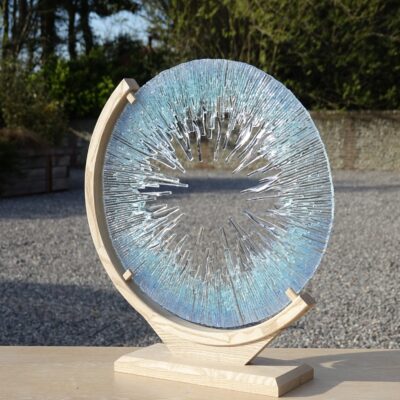 Shimmering blue disk - Glass and wood - 50cm x 56cm x 14cm - by Lorraine Keeler