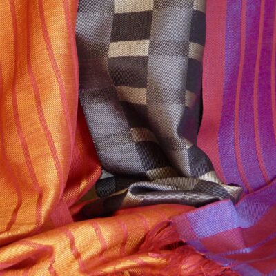 Three silk scarves. Reds and greys. - Handwoven silk. - 30cms x 180cms each scarf. - by Geraldine St. Aubyn Hubbard