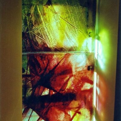 Summerford Church - Glass slumped and enamelled - 2.5 high x 0.75m wide - by Jane Campbell